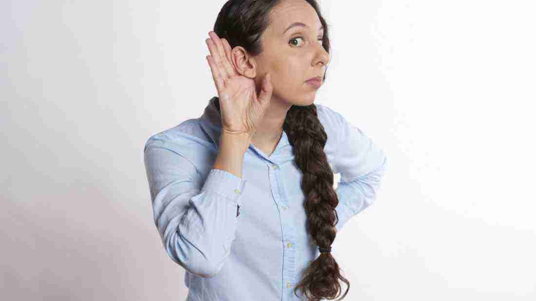 A woman listening carefully