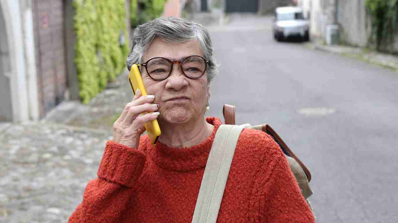 An aggressive old woman on the phone