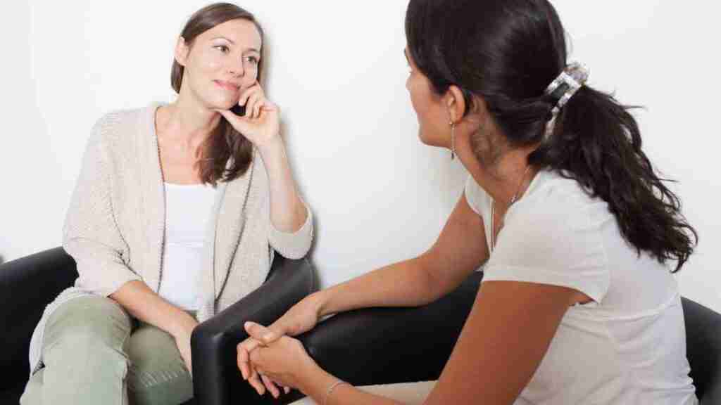 Two women talking.