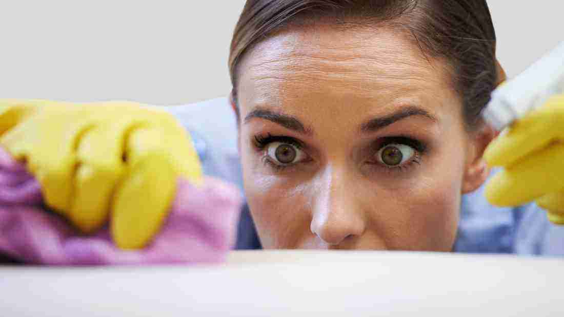 Av woman cleaning compulsively