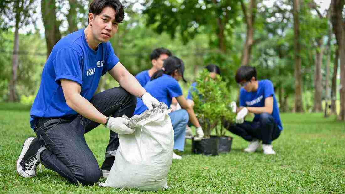 A young man participating in a forest cleanup