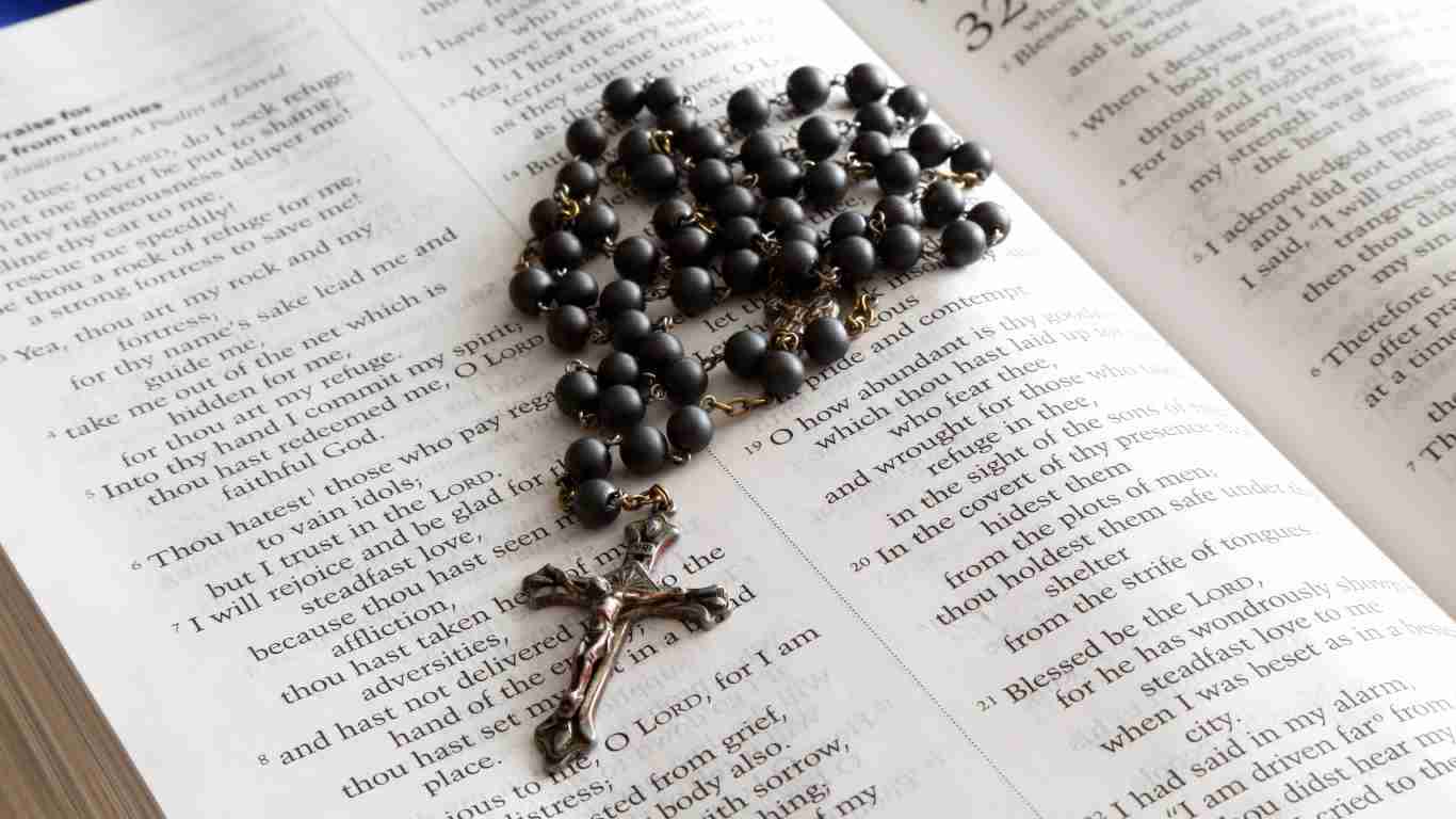 A bible and rosary beads