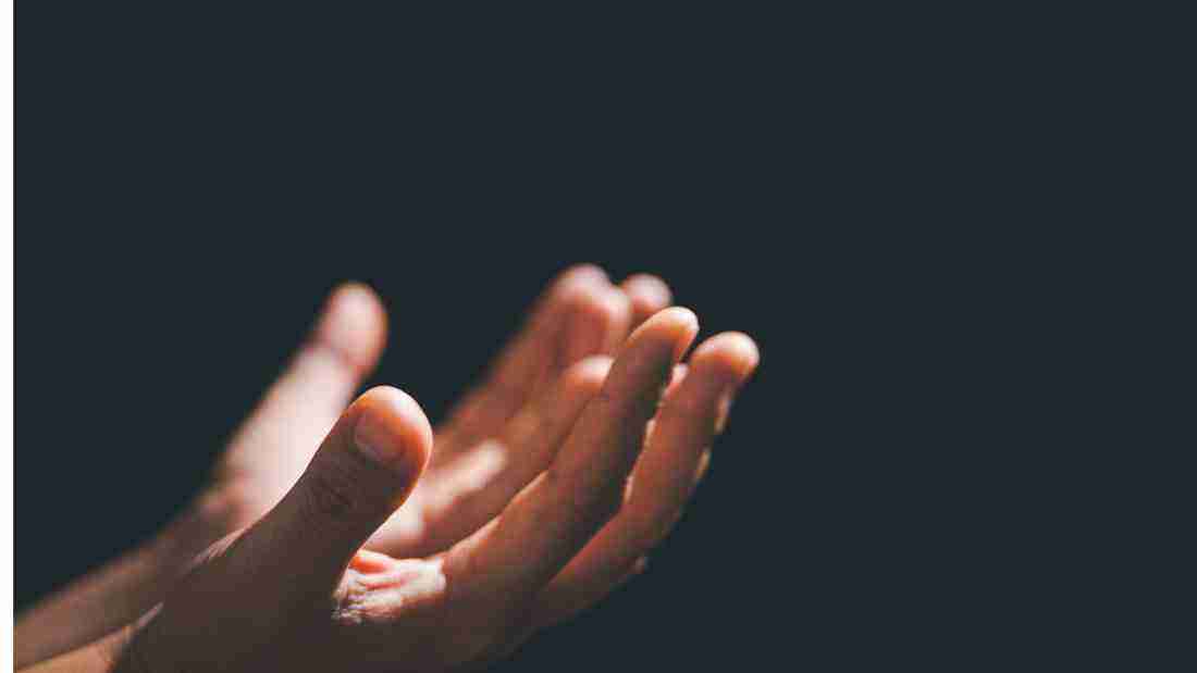 Hands raised in prayer