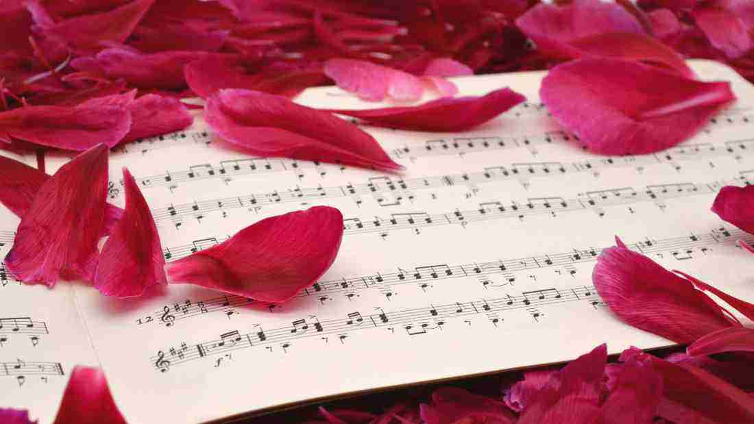 Sheet music covered in petals
