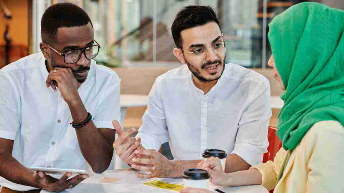 Work colleagues discussing a project