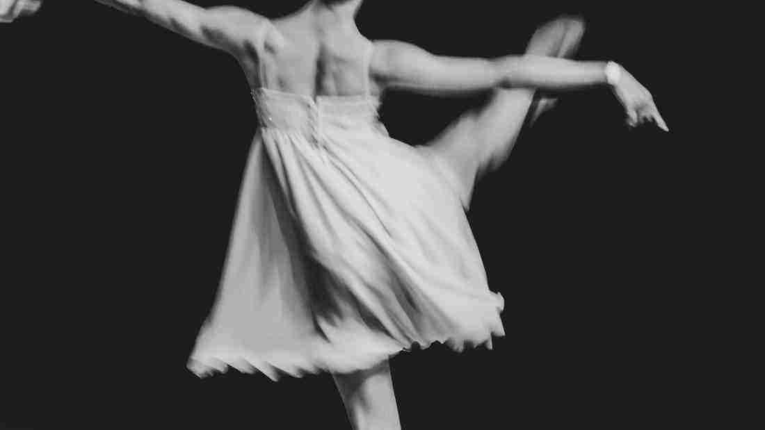 A graceful ballerina dancing on the stage
