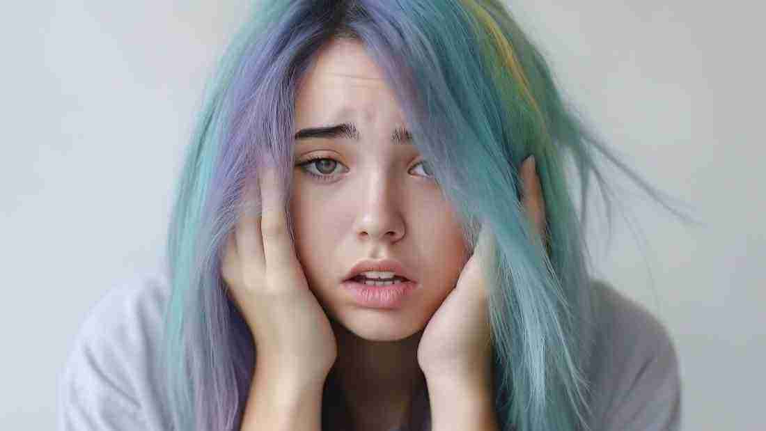 A young woman who appears to be totally overwhelmed