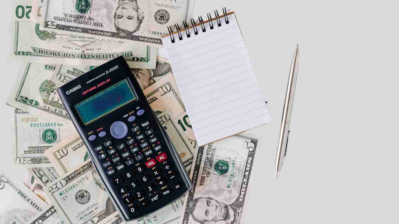 Money and a calculator, denoting financial abuse