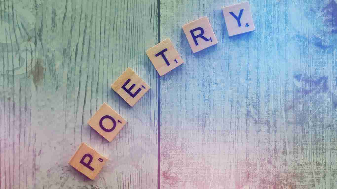 Wooden blocks making up the word POETRY