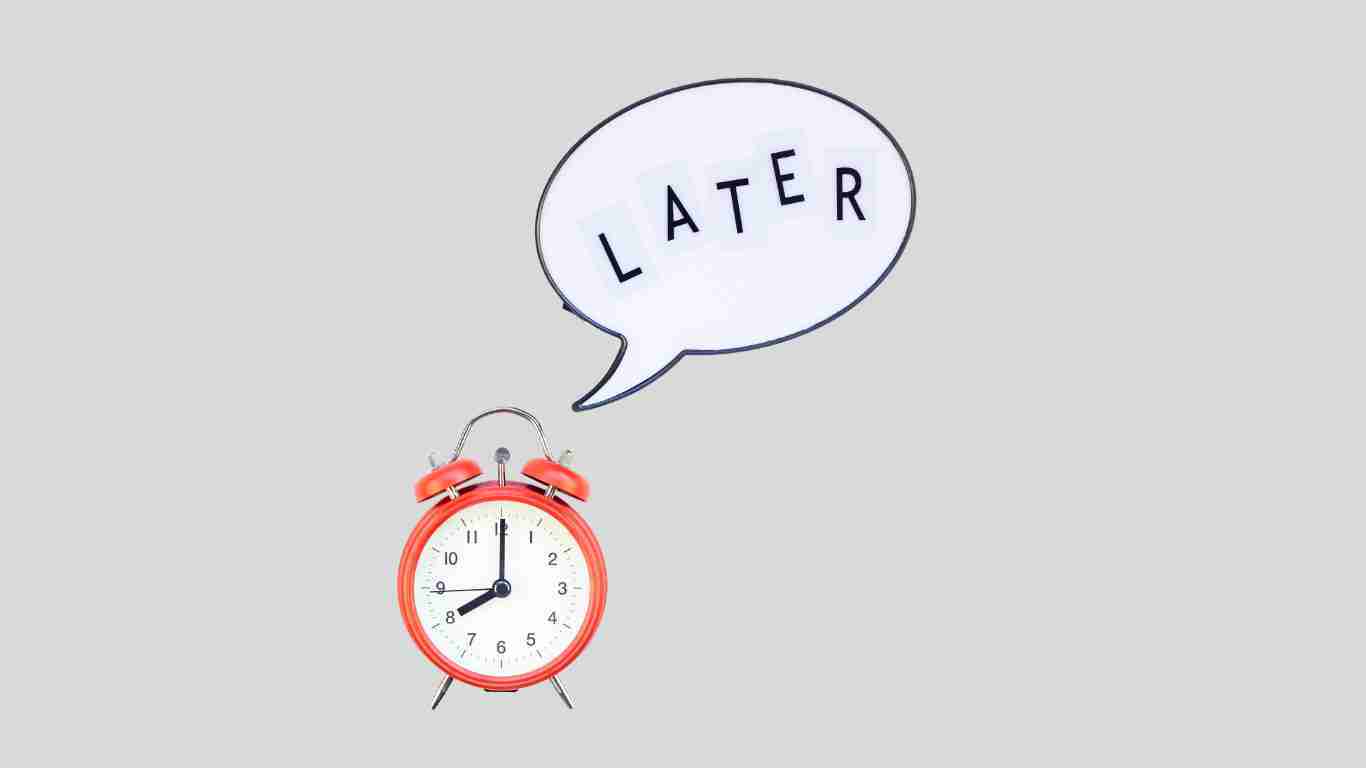 A clock with a speech bubble saying later