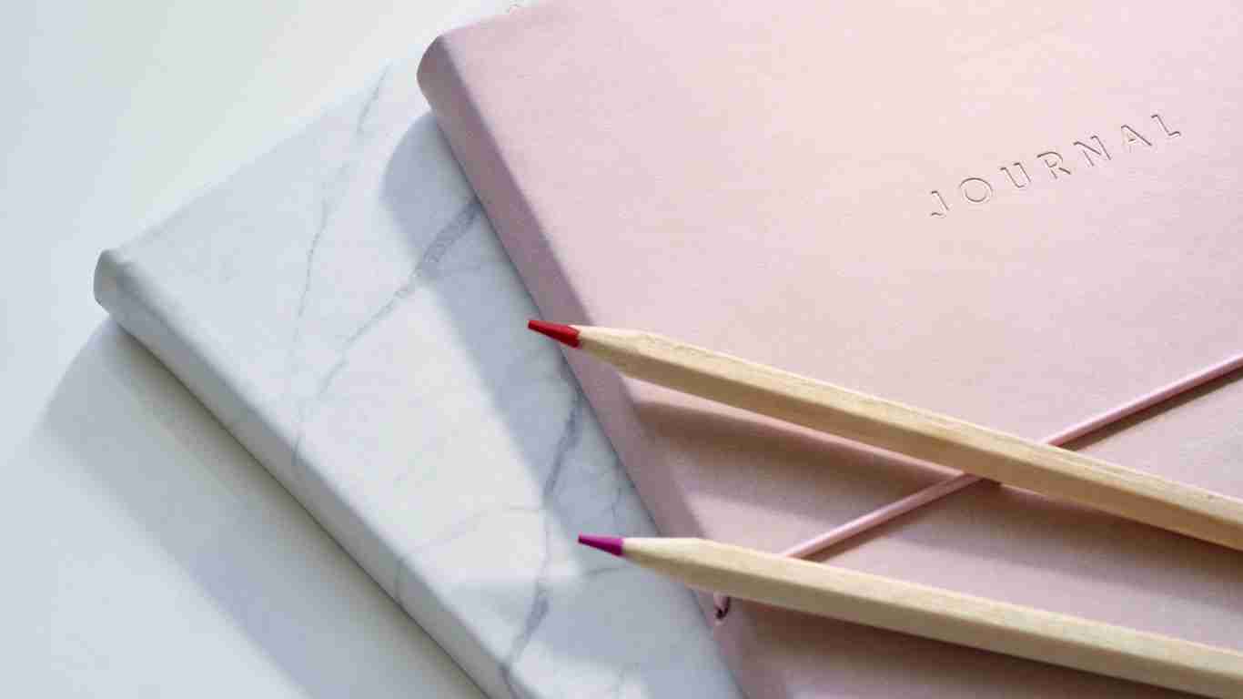 A journal and pencils