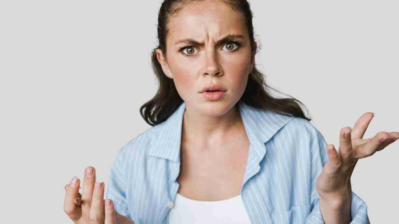 An angry woman waving her hands around in fury