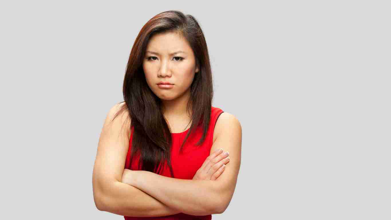 An angry woman scowling