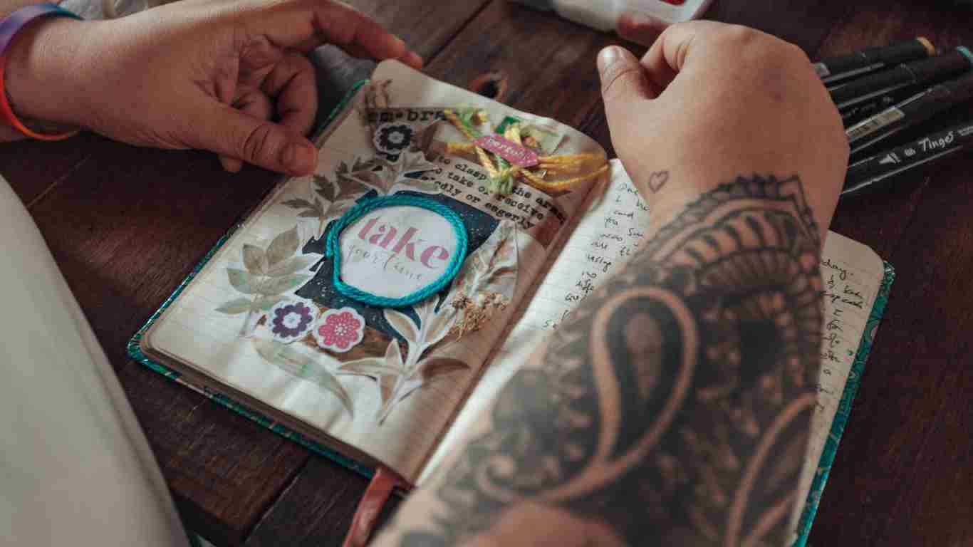 A woman crafting in her journal