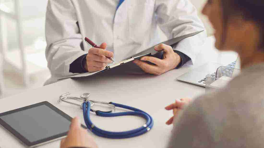 A doctor seeing a patient