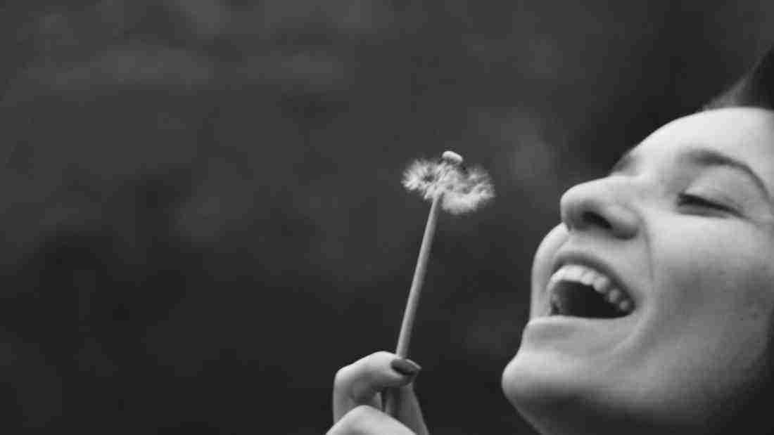 A girl holding a flower