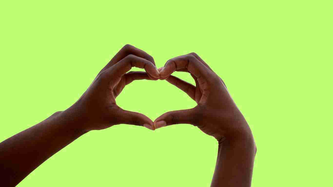 Hands making the sign of a heart, indicating love