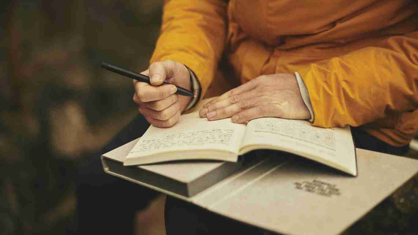 A man writing in his journal