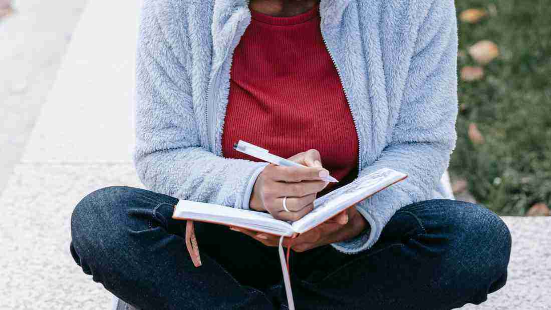 A young woman writing in her diary