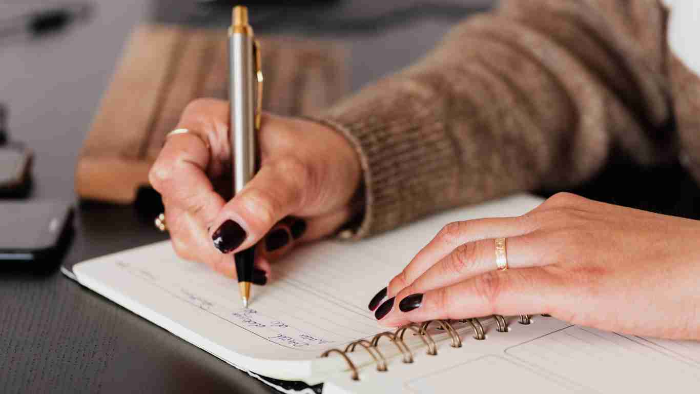 A woman writing in her diary