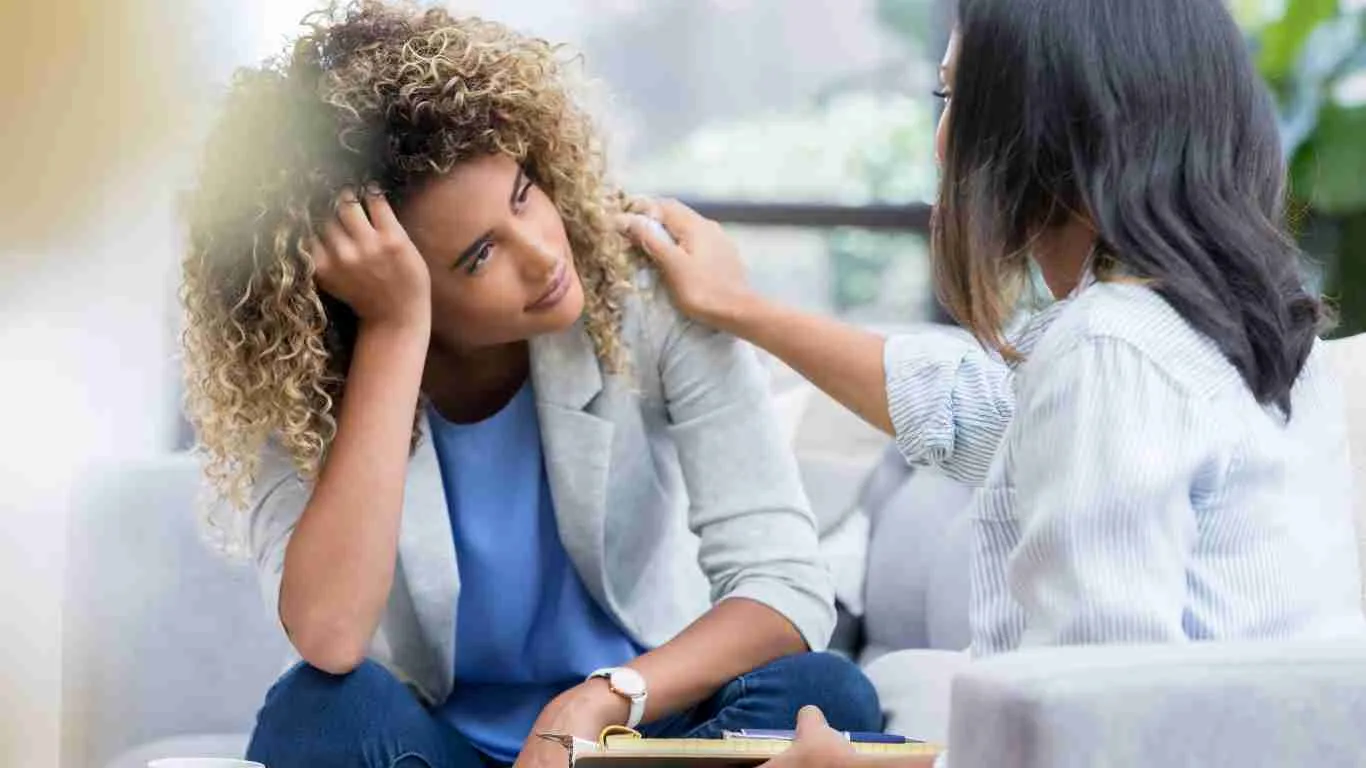 A woman talking to her lawyer.