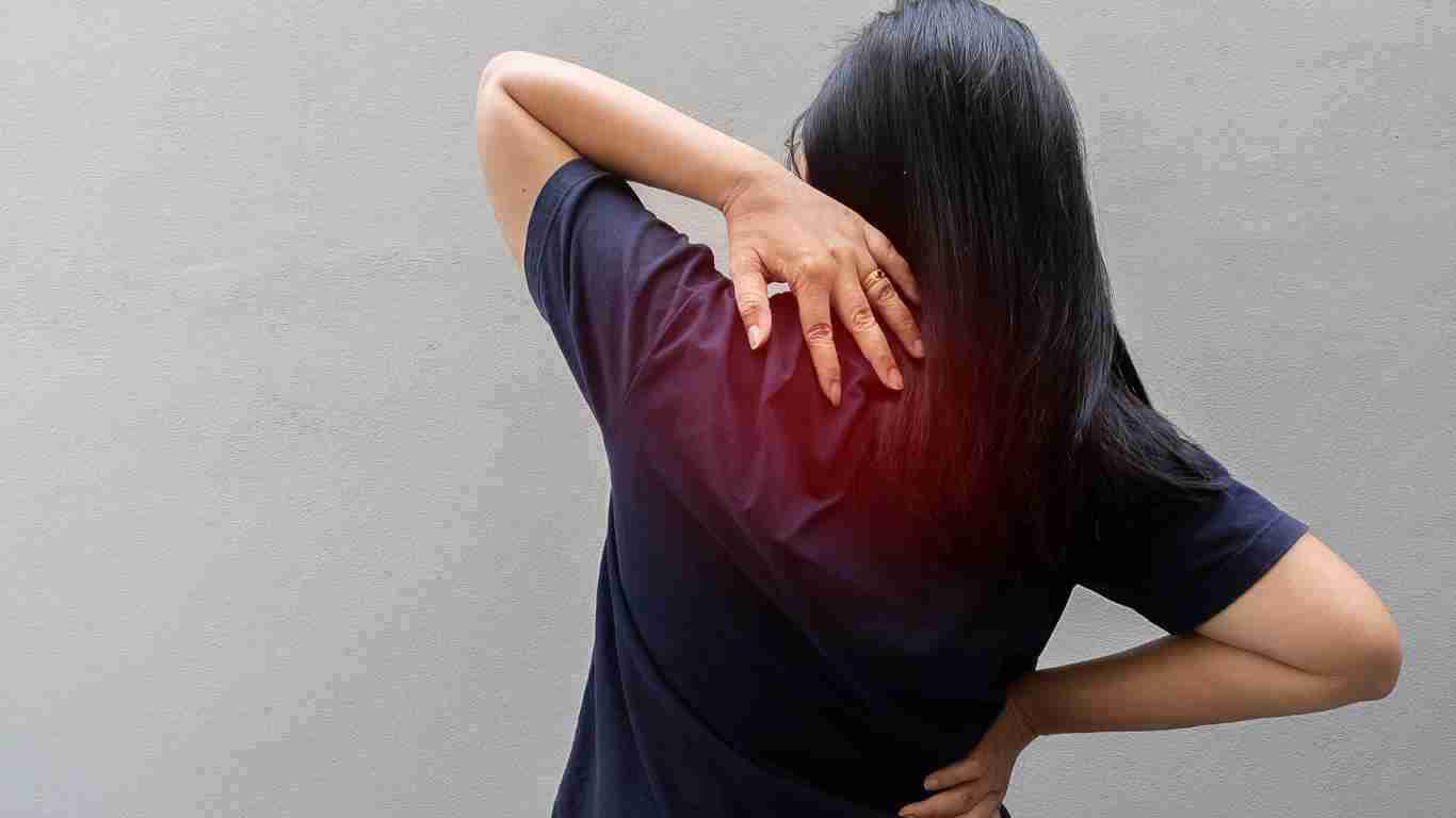 A woman struggling with back pain