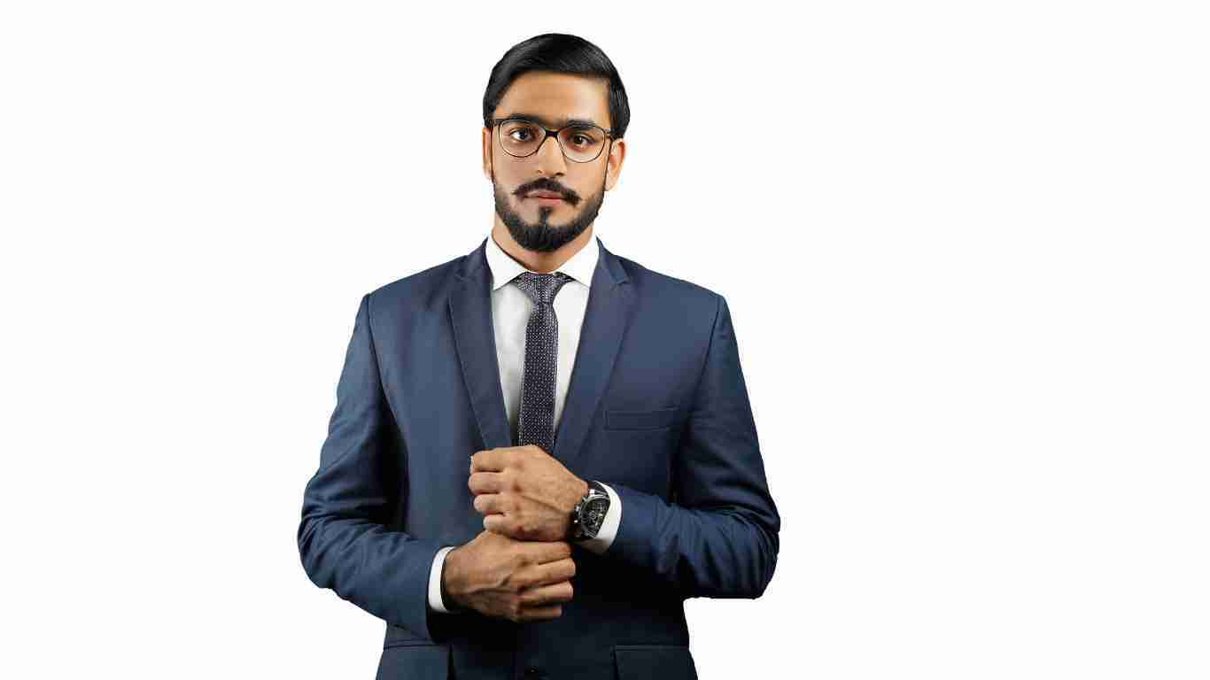 A man wearing a smart suit and a smug look on his face