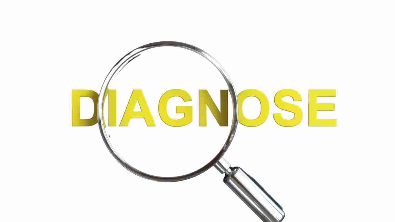 The word diagnosis with a magnifying glass over it