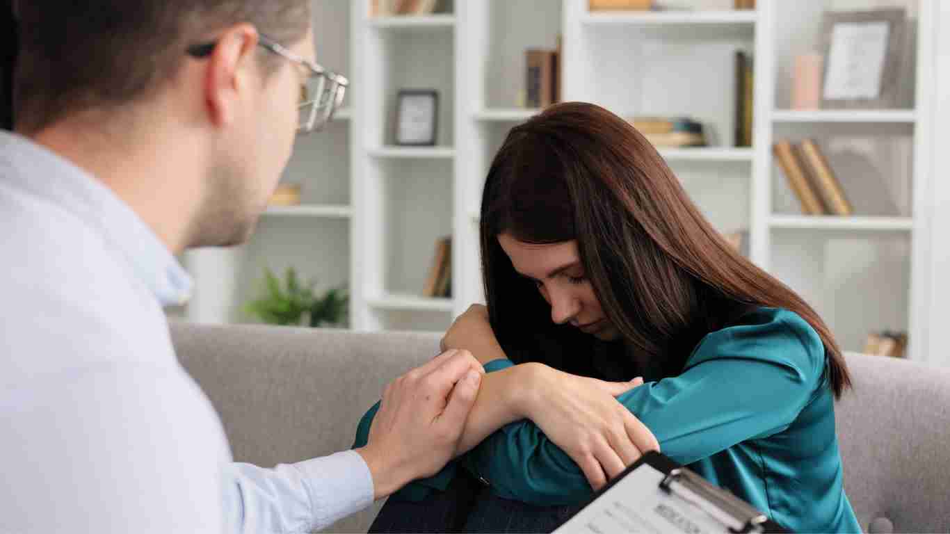 A very distressed woman talking to her therapist