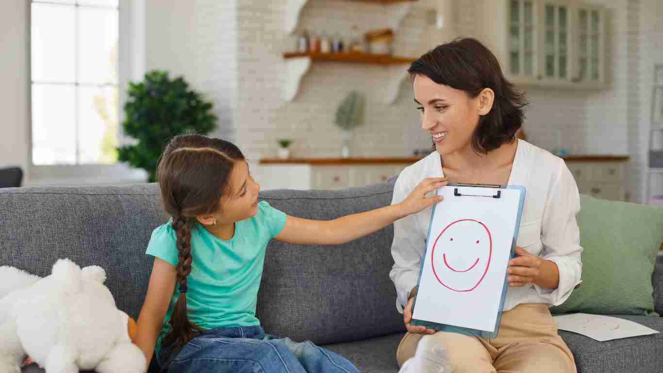 A little girl talking to a therapist