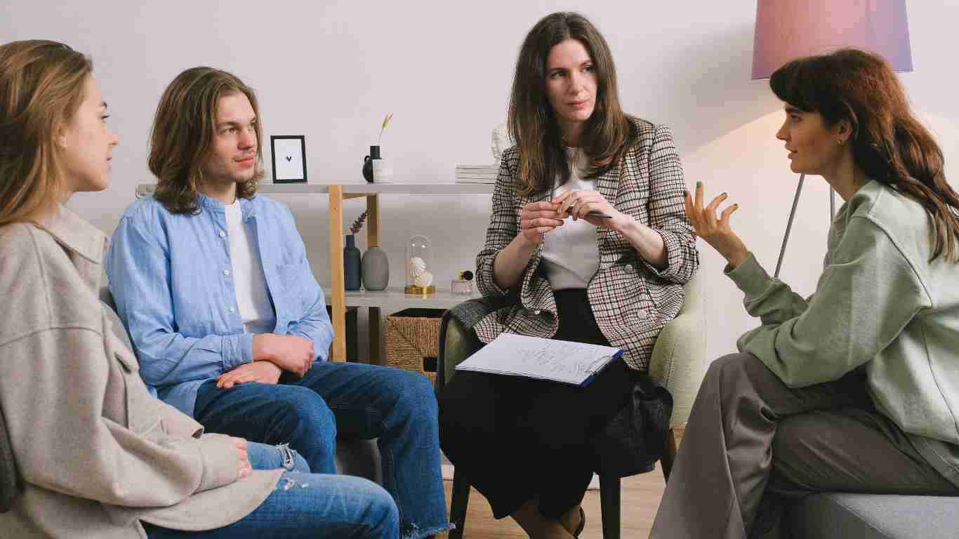 Siblings talking during a family therapy session