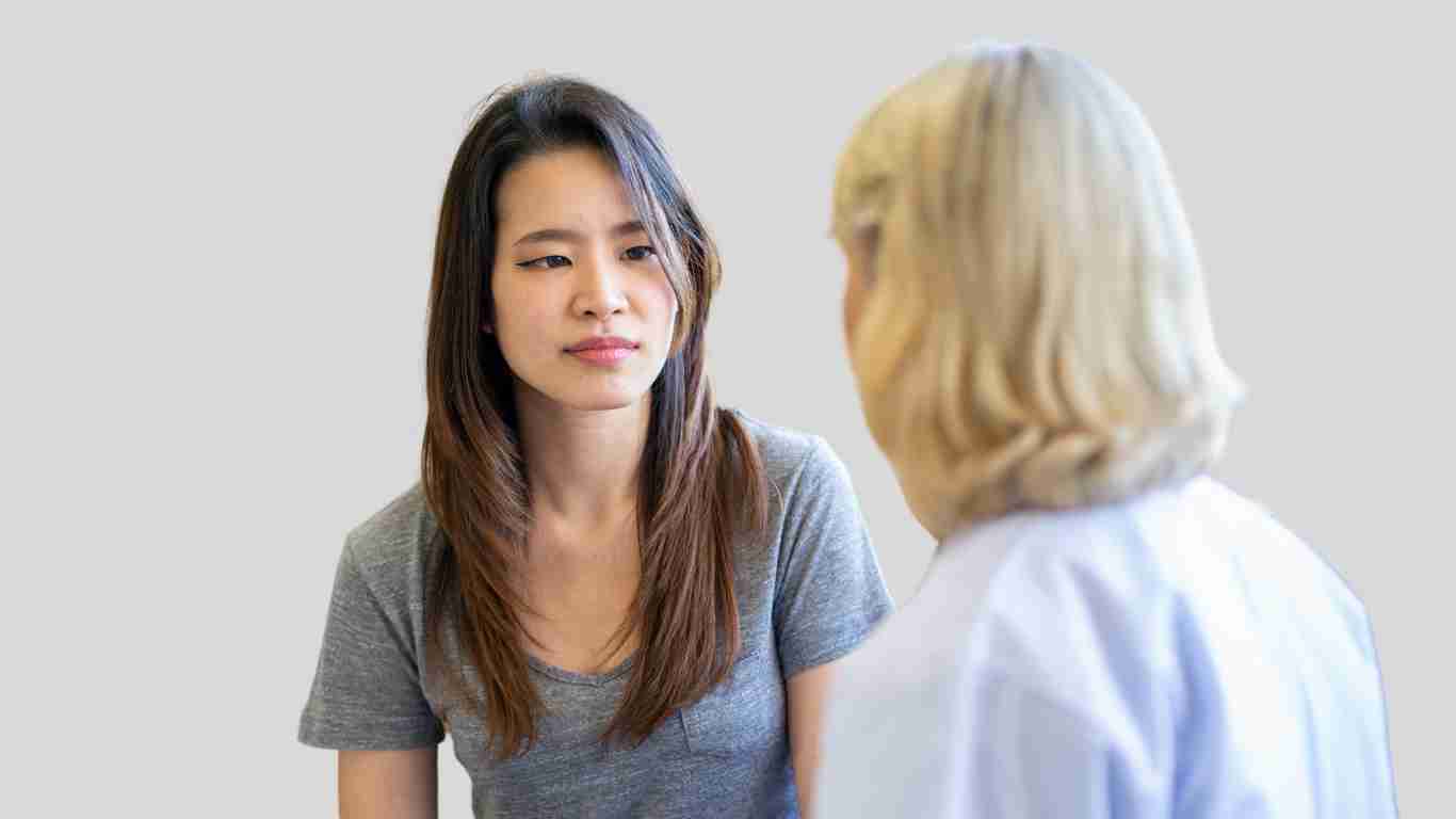 A young woman talking to her therapist
